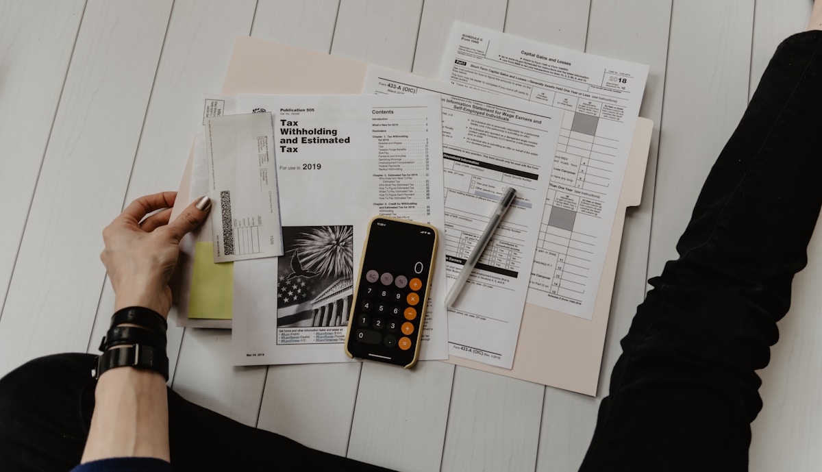 Calculator and property paperwork used to evaluate a fair cash offer for a Virginia home